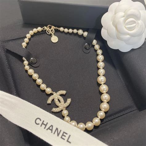 chanel 100th anniversary pearl necklace|Chanel pearl cc necklace.